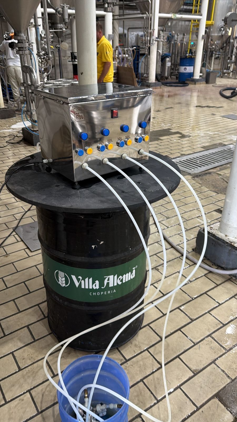 Perfect Fill on a brewery floor, filling through four outlets, each with a blue and a yellow button